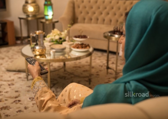 Woman zapping TV channels|-