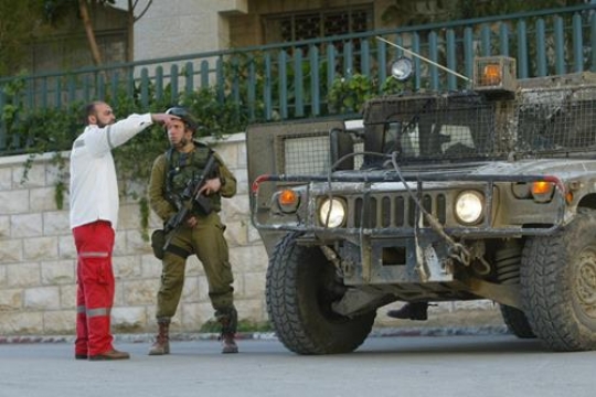 palestinian man with israeli soldier