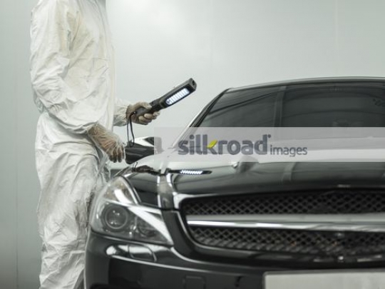 Black car at the workshop|