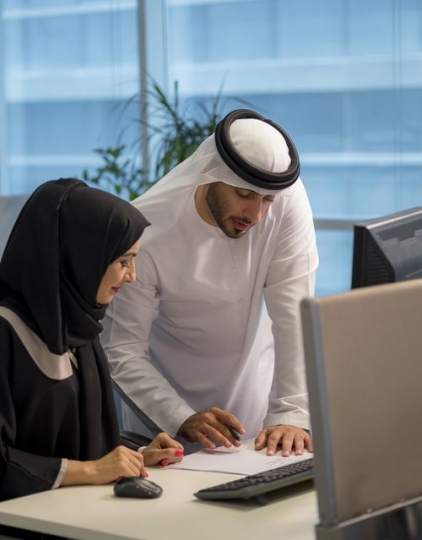 Businessman and woman at the office working together|