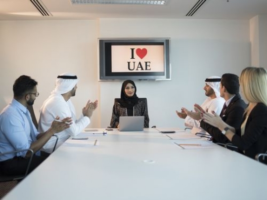 A group of businesspeople clapping hands for their boss during a meeting|-