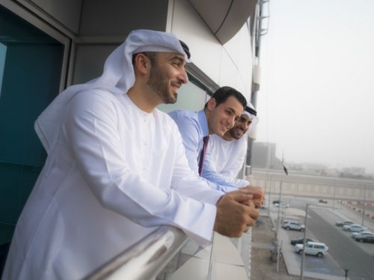 Three businessmen spending time on the balcony