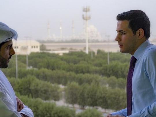 Medium shot of two businessmen communicating outside|-