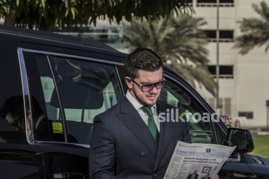 Medium shot of Western Businessman reading the newspaper |-