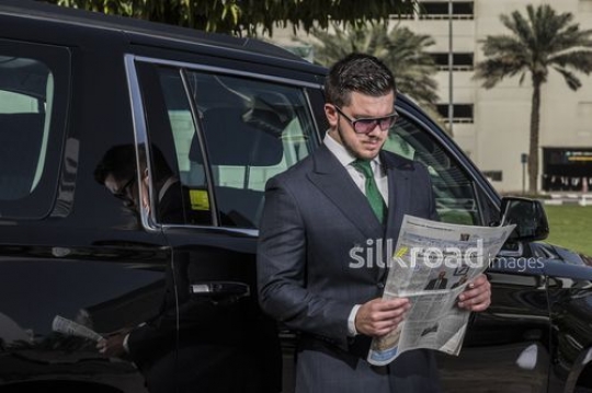 Businessman reading the newspaper |-