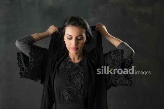 Arabian woman dressed in the traditional attire|