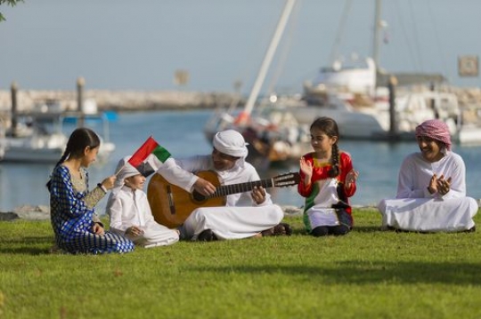 Middle eastern teenagers and kids celebrating national day|-