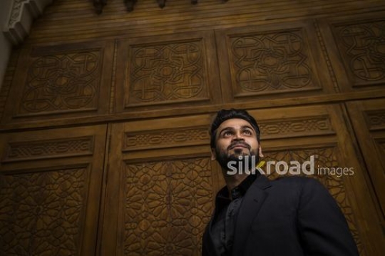 Medium shot of a Businessman dressed in a black suit|-