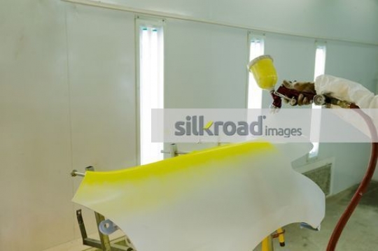 Spray painting the color of the part of the car |