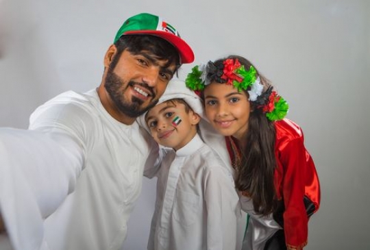 Portrait of a family taking a Selfie for National Day
