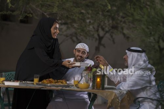 REPLACE - Arab mother offering grandfather food|-