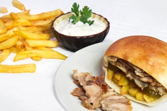 shawarma sandwich in plate with mayonnaise and potatoes