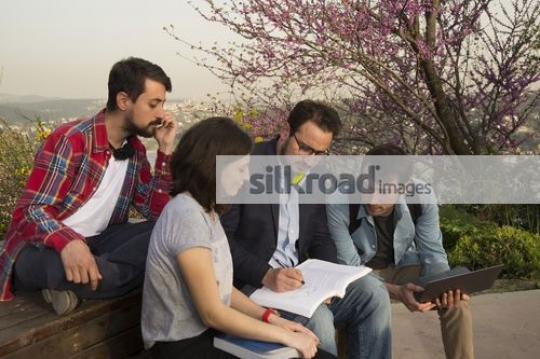 Students talking to the professor|