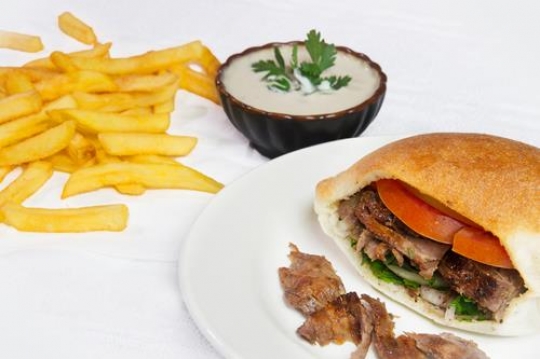 shawarma sandwich in plate with mayonnaise and potatoes