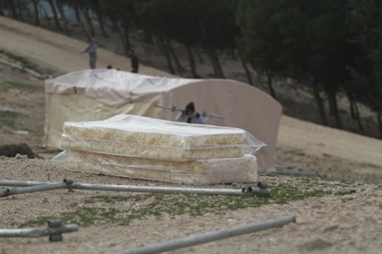 Palestinian demonstrators setting up tent at Bab al-Shams or Gate of the Sun 