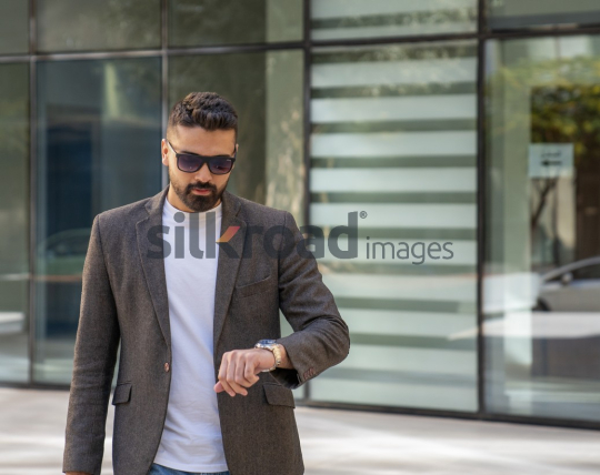 Close-Up of a Professional Man Exiting a Corporate Building
