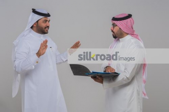 Businessman talking to his employee about work
