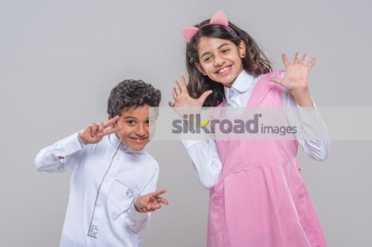 Middle Eastern kids doing silly faces