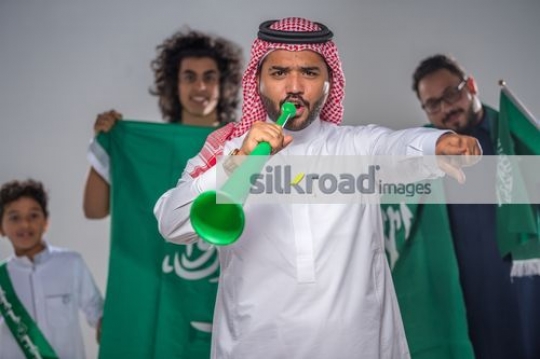 Middle Eastern family representing their country|