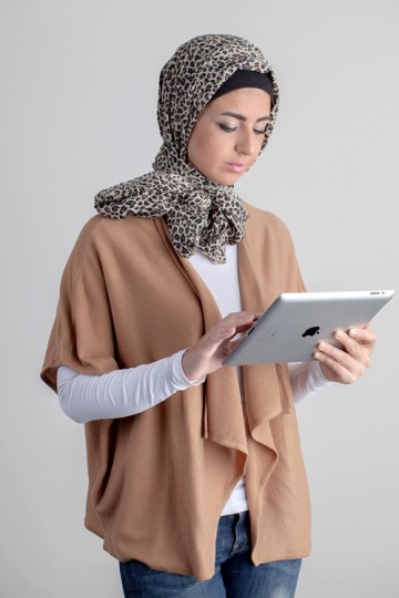 young woman holding ipad