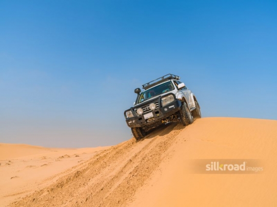 Big car cruising in the desert
