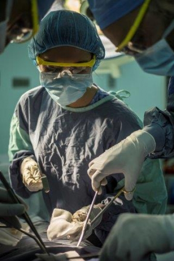 Surgeons Running an Operation