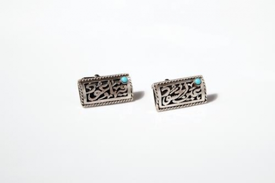 silver earrings isolated on white