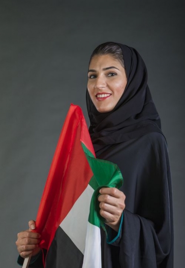 Middle Eastern woman proudly celebrating her own country