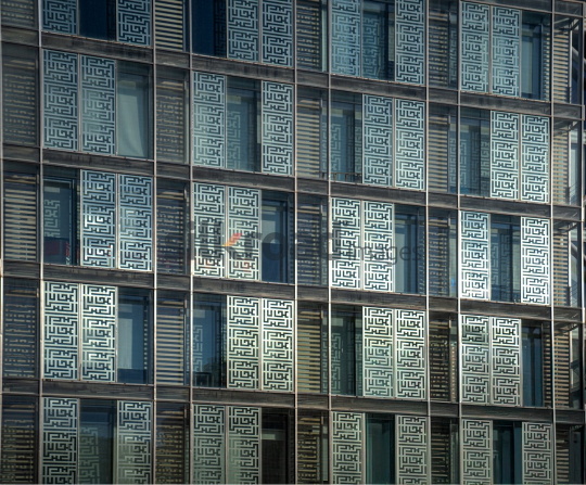 Stunning View of Al Abdali Boulevard with Sunlit Glass Building Wall