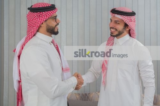 Arab Businessmen shaking hands|
